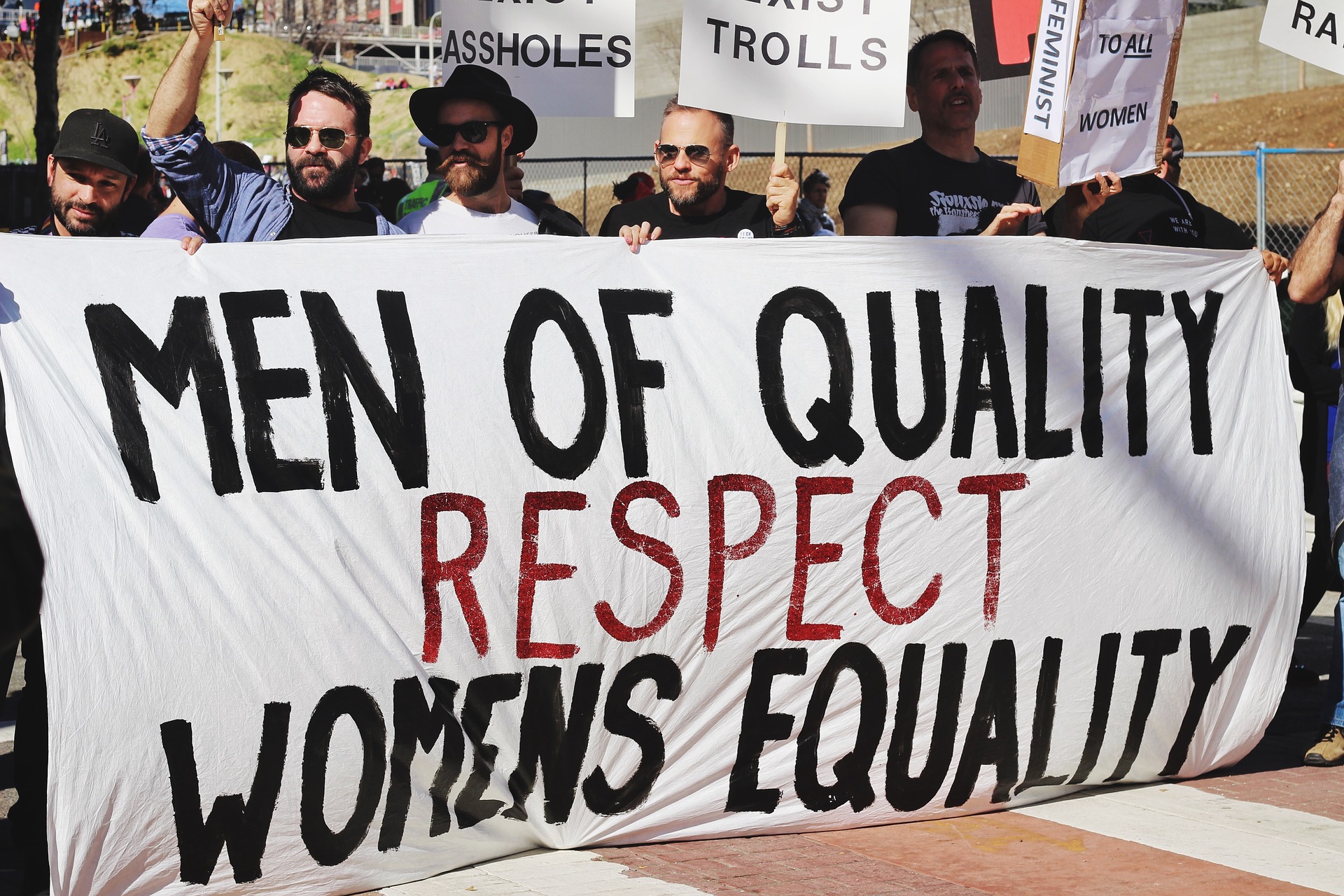 Protest sign, "men respect women's equality"