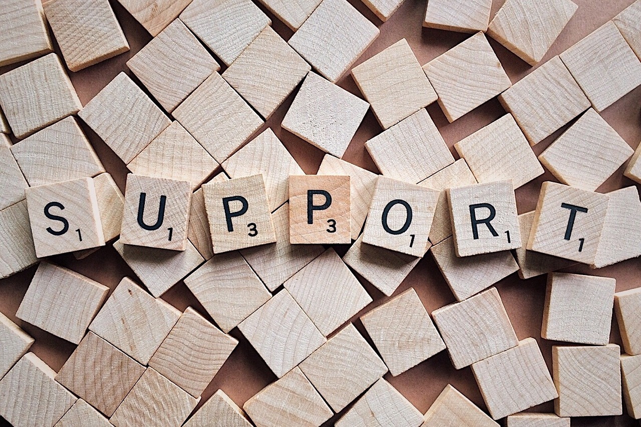 "support" spelled out in Scrabble letters
