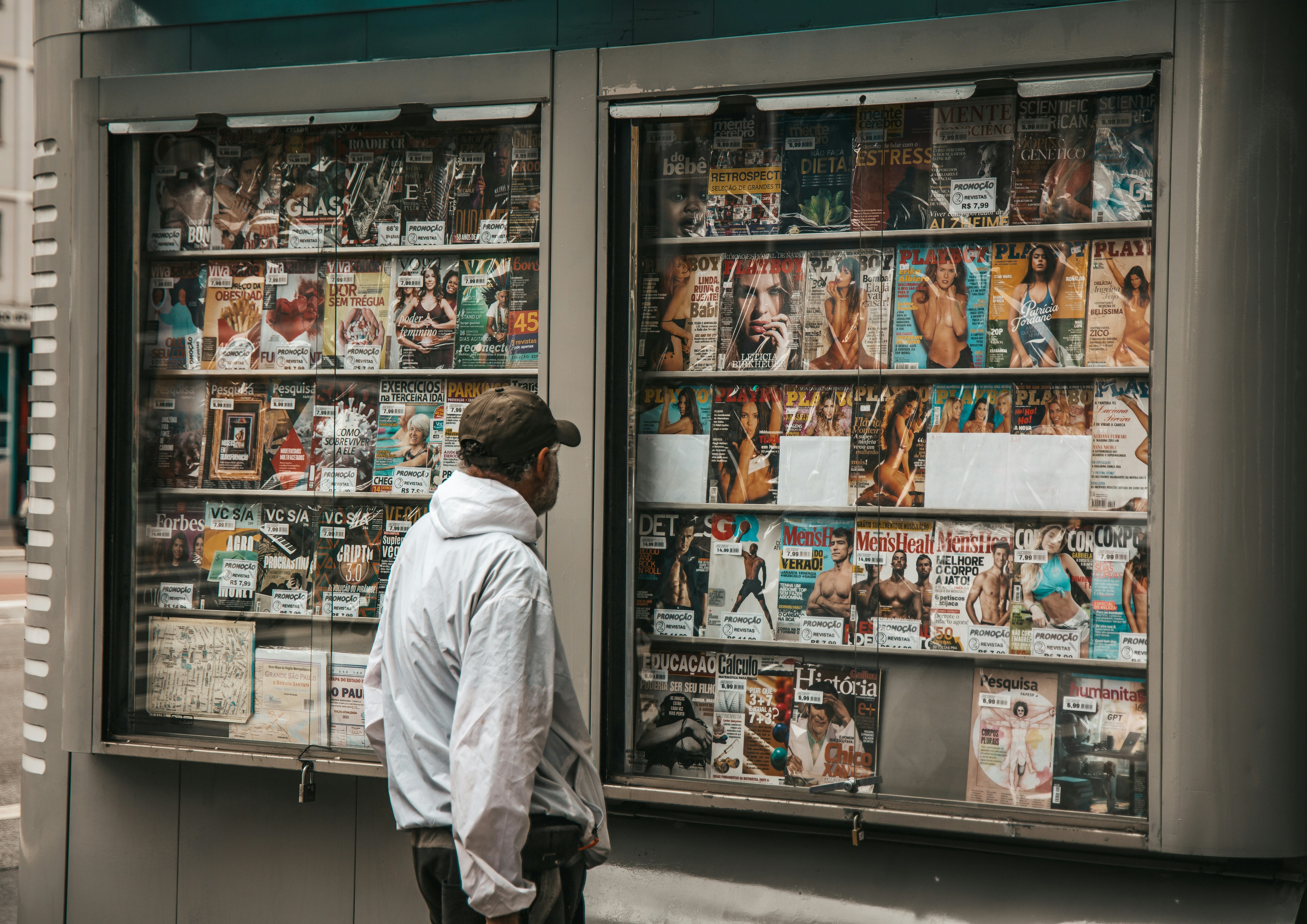 man looking at pornographic magazines